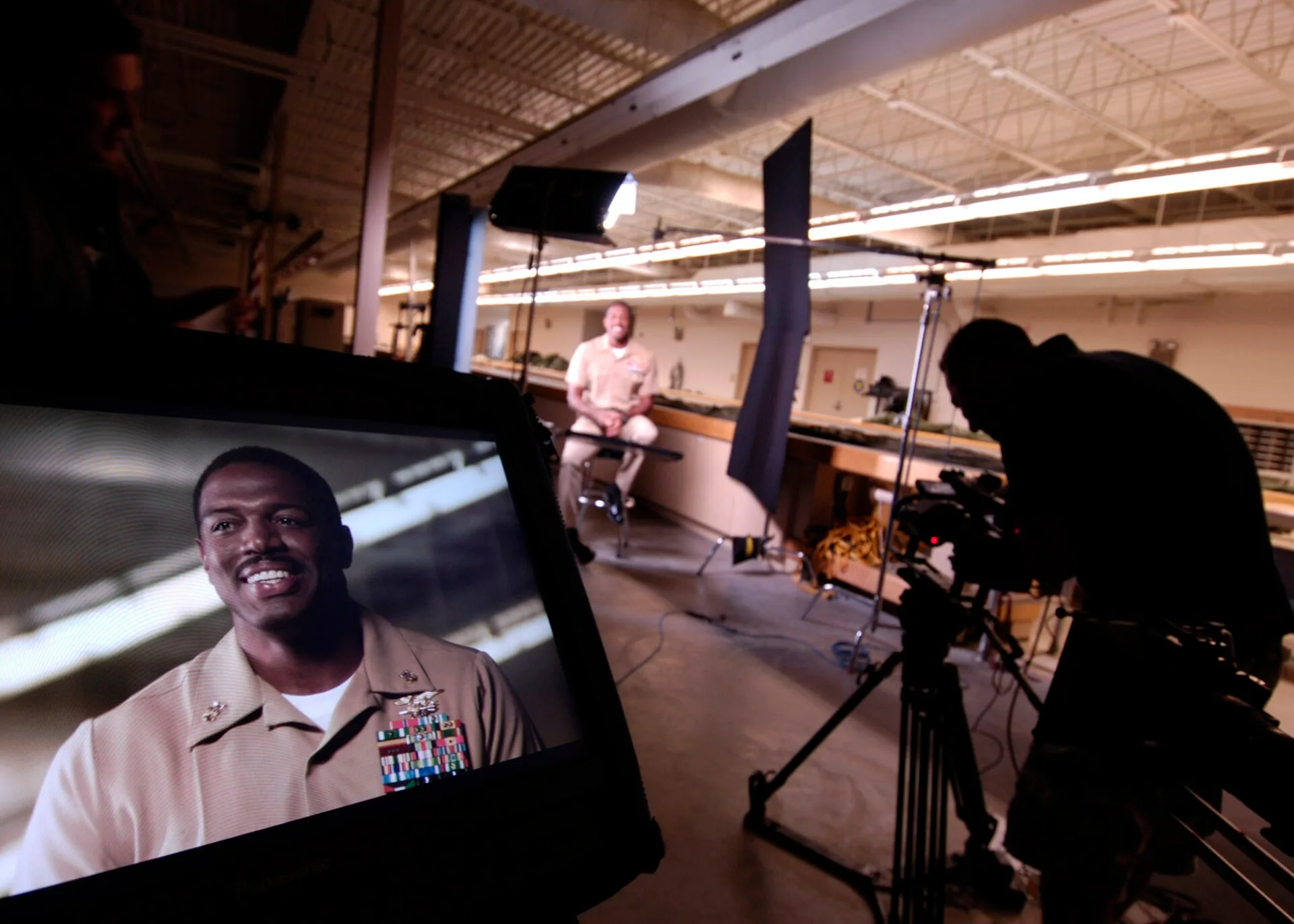 NORFOLK (June 23, 2009) Master Chief Special Warfare Operator (SEAL) Shawn Johnson is interviewed for a recruiting video from members of a Discovery Channel production team. The Commander, Navy Recruiting Command is sponsoring the production of recruiting vignettes aimed at attracting Americans of d